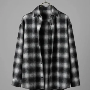 Man wearing black and white checkered flannel shirt for casual style